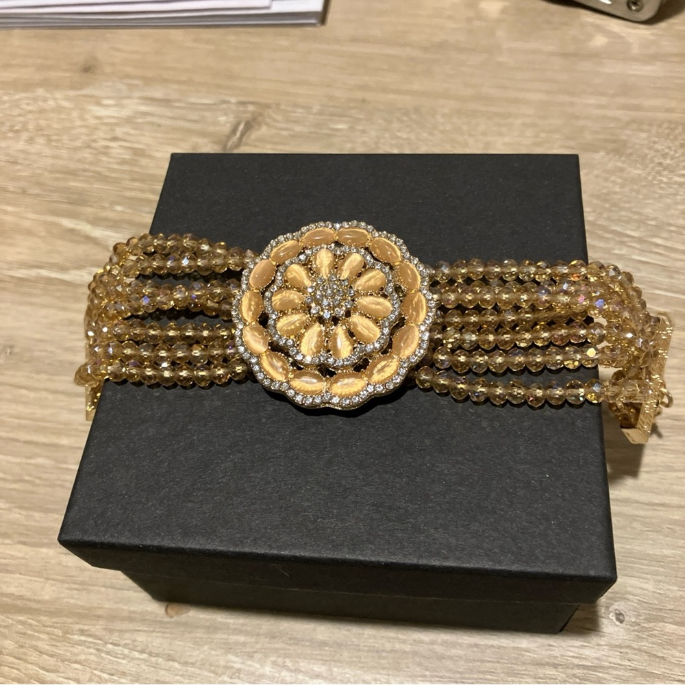 Elegant Gold Beaded Bracelet with Floral Accent